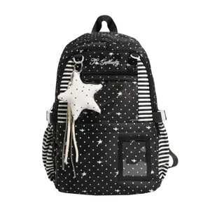 Sac à dos noir à pois et étoiles blanches, bordures rayées, fenêtre transparente et breloque étoile