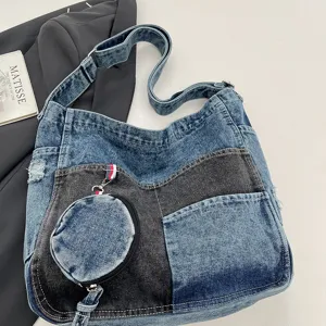 Flat lay of blue and charcoal denim panels, a large front pocket and an attached round coin pouch