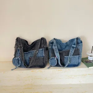 Denim shoulder bags in gray-blue patchwork, shown side by side with matching round coin purses
