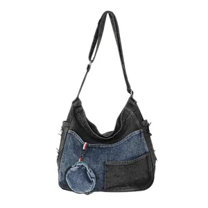 Large denim shoulder bag with black and blue washed patchwork, front pocket and round coin pouch