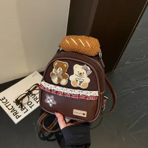 Brown PU leather mini backpack with teddy bear patches, plaid bow, lace trim and plush handle