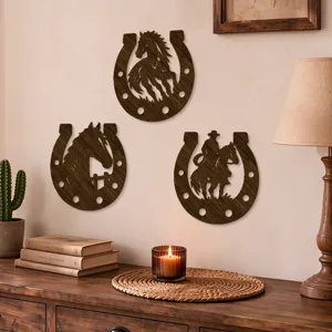 Three dark wooden horseshoe wall hangings with cutout horse and cowboy motifs on a beige wall