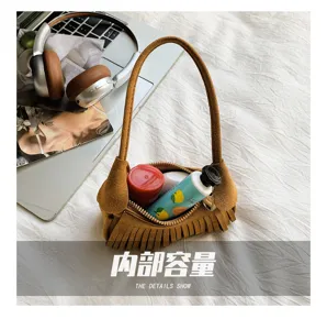 Open brown suede-look bag showing space for cosmetics and small everyday essentials
