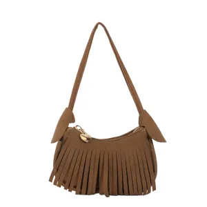 Brown suede-look fringe shoulder bag with a long strap, zip closure and gold heart charm