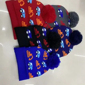 Children's knit beanies with cartoon excavators and pom-poms, arranged in several colors