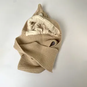 Beige rib-knit hood scarf laid flat, showing its soft cream fleece lining and pointed hood.