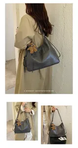 Lifestyle collage showing a woman carrying a gray shoulder bag with a small bear charm in two ways