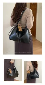 Back view shows a soft black bag with an adjustable strap, tassel details and a teddy bear charm.