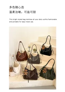 Faux-leather bags in brown, black, cream and green, with bear charms and tassels arranged on stairs