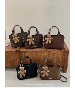 Five suede-look bags in olive, leopard brown, dark brown, black and taupe, with teddy charms