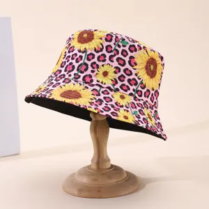 Pink leopard print and yellow sunflower pattern shown with the hat’s contrasting black underside
