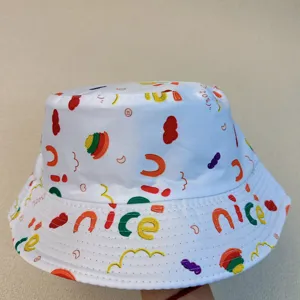 Close-up of a white bucket hat covered in colorful pasta prints and playful “nice” lettering