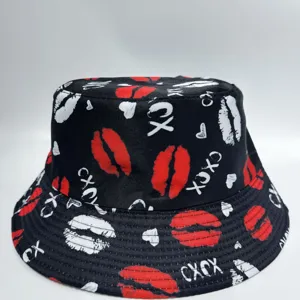 Black bucket hat shown flat, with an all-over print of red and white lips, hearts, and XOXO