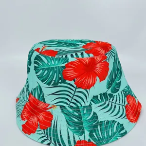 Turquoise fabric with tropical leaves and red hibiscus flowers, shown with a neatly stitched brim
