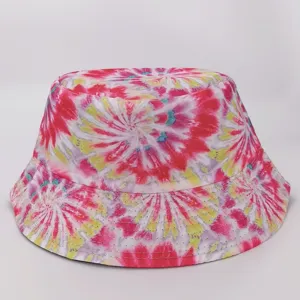 Front view of a bucket hat with vivid radial tie-dye in pink, white, yellow and turquoise