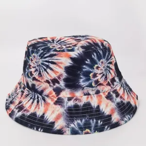 Front view highlighting navy, white, and orange spiral tie-dye fabric and stitched brim seams