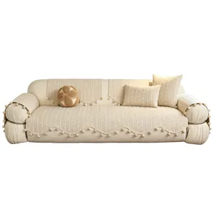 Cream beige chenille sofa cover set with raised stripe texture, pompom trim and matching pillows