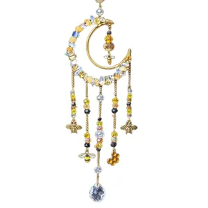 Golden crescent moon crystal suncatcher with bee and honeycomb charms for window decor