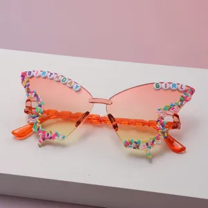 Close-up of colorful bead trim and BIRTHDAY GIRL lettering on gradient butterfly lenses