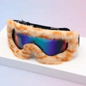 Close-up of orange and cream striped faux-fur trim around an iridescent blue-purple-green lens