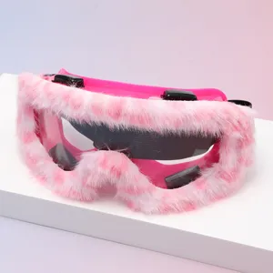 Close-up of pink goggles with fluffy pink-and-white trim, clear lenses and adjustable black clips