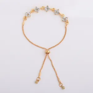 Gold-tone box chain detail with white crystal flower accents and an adjustable slider clasp