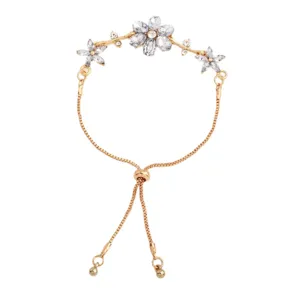 Gold-tone adjustable chain bracelet with clear crystal flowers, shown flat on a white background
