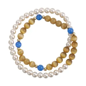 Bracciale elastico a doppio giro con perle color avorio, occhio di gatto ambrato e dettagli blu