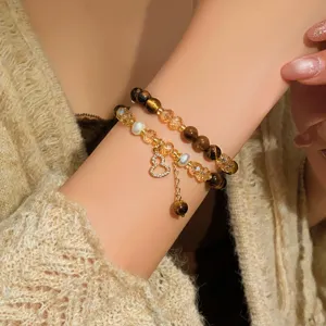 Bracciale doppio con occhio di tigre, cristalli, perle d'acqua dolce e ciondolo dorato a zucca