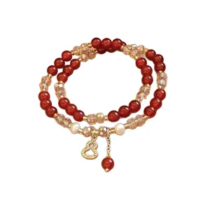 Bracciale doppio con perline rosse, perle, cristalli sfaccettati e ciondolo dorato a zucca