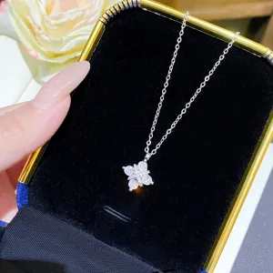 Silver-tone chain with a sparkling flower pendant displayed in a black velvet jewelry box