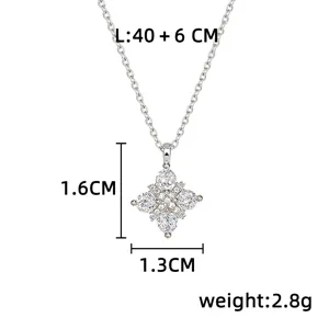 Silver-tone pendant with sparkling diamond-shaped floral stones, shown with size labels