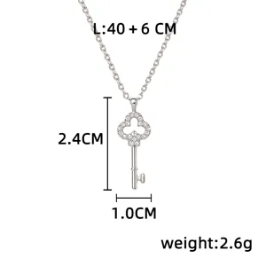 Silver key pendant with a sparkling clover top, shown with chain length and pendant measurements