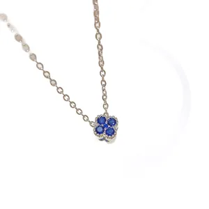 Silver-tone titanium steel necklace with fine chain and four-petal flower pendant with blue stones