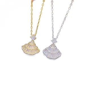 Gold and silver fan-shaped pendant necklaces with sparkling zircon-style stones on oval-link chains