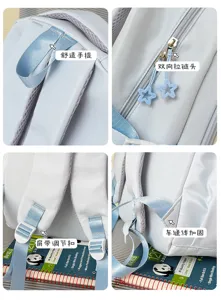 Close-up of light blue fabric, star zipper pulls, adjustable strap buckles and reinforced seams
