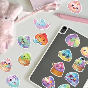 Close-up of holographic dumpling character stickers in pastel colors arranged on a tablet