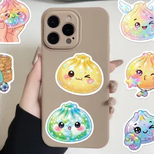 Glittery yellow and green cartoon bun stickers decorate a beige phone case, with more designs around it