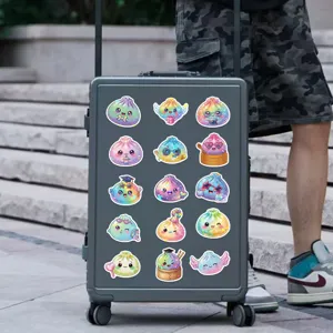Colorful glitter cartoon dumpling stickers arranged in rows on a dark suitcase outdoors