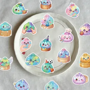 Flat lay of colorful holographic glitter dumpling character stickers arranged around a white plate