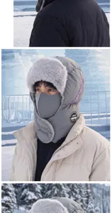 Nahaufnahme einer grauen Winterhaube mit Kunstfellfutter, Ohrenschutz und integrierter Gesichtsmaske