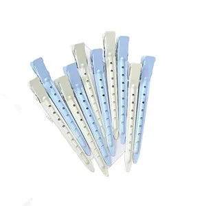Blue and white perforated metal duckbill hair clips arranged in a fan on a white background