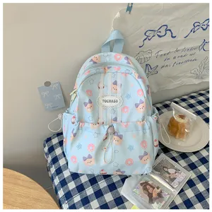 Sac bleu clair à motifs d’ours et de donuts, avec étiquette en dentelle, poche zippée et cordon