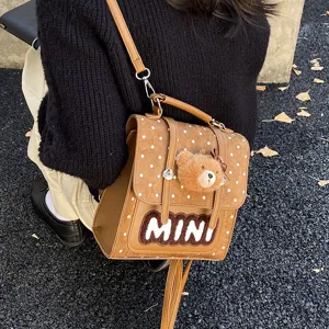 Petit sac bandoulière marron en PU et velours, à pois blancs, avec un pendentif ourson