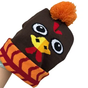 Bonnet tricoté brun foncé avec dinde de Thanksgiving, pompon orange et revers à motifs
