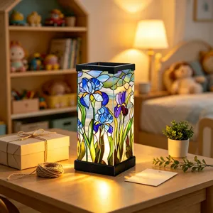 Iris-patterned glass panels glow on a wooden table in a softly lit bedroom scene