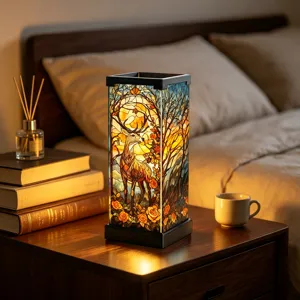 Warm bedside scene with a glowing stained-glass lamp depicting a deer among autumn trees and roses