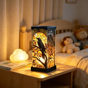 Warm bedside scene showing an illuminated stained-glass lamp with a raven and autumn leaves
