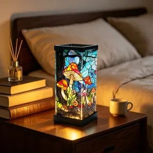 Illuminated stained-glass mushroom forest lamp on a bedside table in a warm bedroom scene