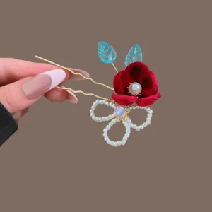 Traditional Chinese red velvet flower hairpin with pearl and blue leaf accents, gold U-shaped pin